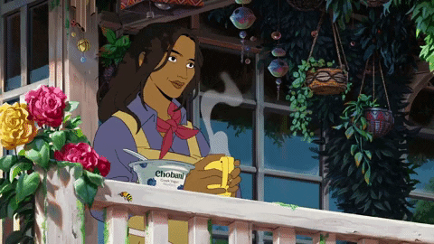 An animated woman in a blue shirt, red kerchief around her neck, and a tan apron sets a steaming mug of tea on the rail of a porch. There are flowers and plants hanging from the rail and in the background.
